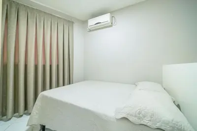 Uma cama ou camas num quarto em Condomínio Solar das Bromélias