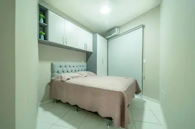Uma cama ou camas num quarto em Condomínio Solar das Bromélias