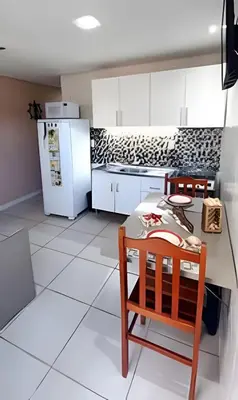 A cozinha ou kitchenette de Apartamento térreo climatizado próximo a praia