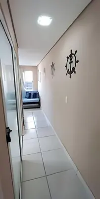 Uma cama ou camas num quarto em Apartamento térreo climatizado próximo a praia
