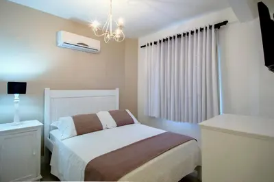 Uma cama ou camas num quarto em Pousada Bora Bora