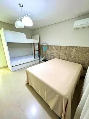 Uma cama ou camas num quarto em ANSNEGOCIOS CASA PISCINA AQUECIDA PRAIA MARISCAL - Ac