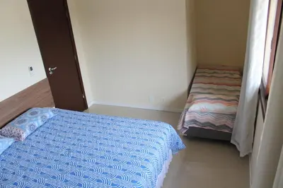 Uma cama ou camas num quarto em Residencial Hannah - Casa 6 - Porto Belo SC - Bairro Perequê