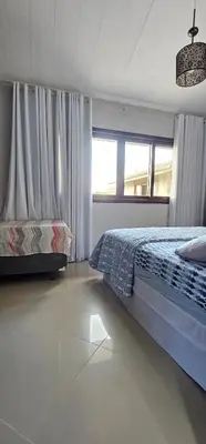 Uma cama ou camas num quarto em Residencial Hannah - Casa 6 - Porto Belo SC - Bairro Perequê