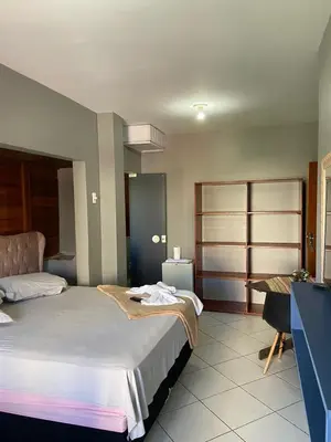 Uma cama ou camas num quarto em Pousada Vovo Valdir