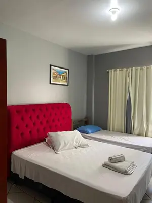 Uma cama ou camas num quarto em Pousada Vovo Valdir