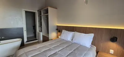 Uma cama ou camas num quarto em Pousada dos Ingleses