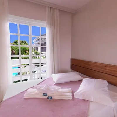 Uma cama ou camas num quarto em Hotel Pousada Ilha do Mar Bombinhas