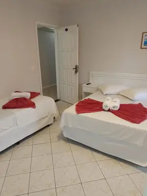 Uma cama ou camas num quarto em Hotel Pousada Ilha do Mar Bombinhas