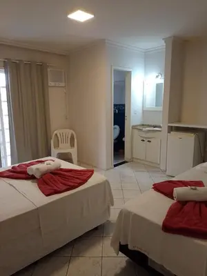 Uma cama ou camas num quarto em Hotel Pousada Ilha do Mar Bombinhas