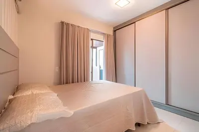 Uma cama ou camas num quarto em Residencial Ribeiro