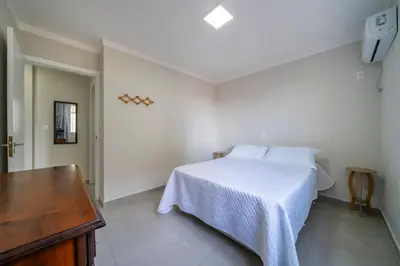 Uma cama ou camas num quarto em Residencial Ilha de Majorca
