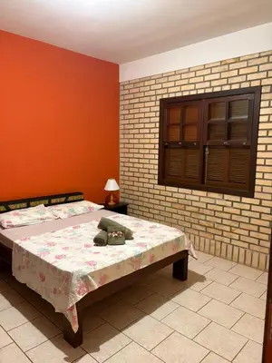 Uma cama ou camas num quarto em Pousada Mare Mansa