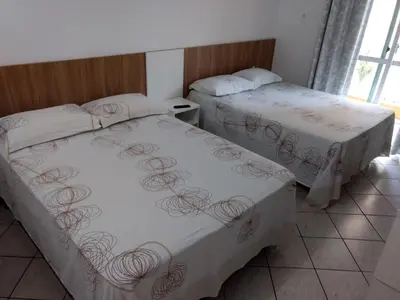 Uma cama ou camas num quarto em Pousada Terra do Sol