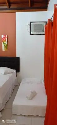 Uma cama ou camas num quarto em Pousada Jardim Porto Belo