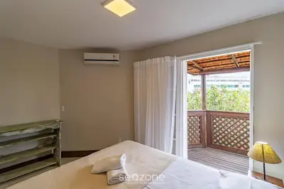 Uma cama ou camas num quarto em Lindo condomínio em meio à natureza em Bombinhas VLE