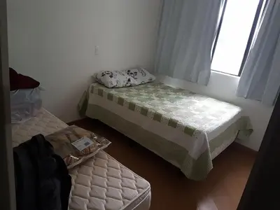 Uma cama ou camas num quarto em Novo lar Camboriu Park Frente Mar