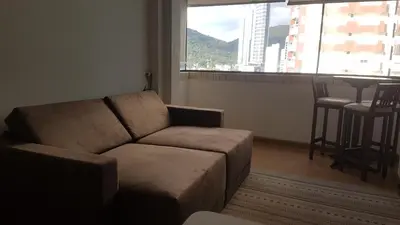 Uma área de estar em Novo lar Camboriu Park Frente Mar