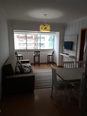 Uma televisão e/ou sistema de entretenimento em Novo lar Camboriu Park Frente Mar