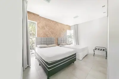 Uma cama ou camas num quarto em Casa de Praia, Balneário Camboriú