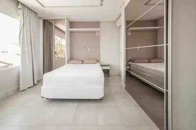Uma cama ou camas num quarto em Casa de Praia, Balneário Camboriú