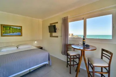 Uma cama ou camas num quarto em Bomar Residence