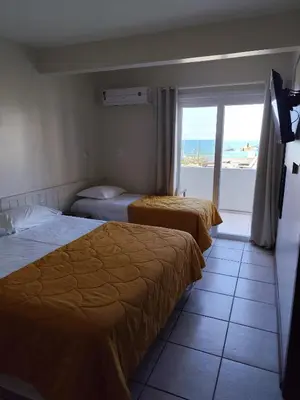 Uma cama ou camas num quarto em Bomar Residence