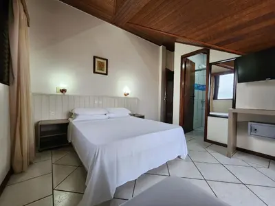 Uma cama ou camas num quarto em Bomar Residence