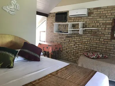 Uma cama ou camas num quarto em Pousada Beija-Flor