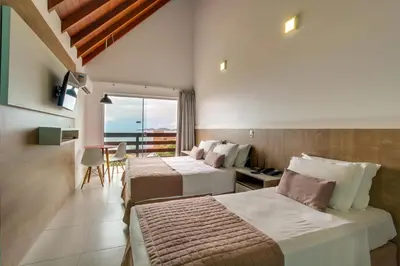 Uma cama ou camas num quarto em Pousada do Arvoredo