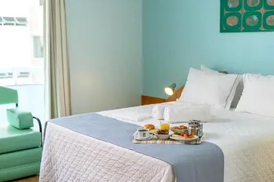 Uma cama ou camas num quarto em Solis Praia Hotel Itapema