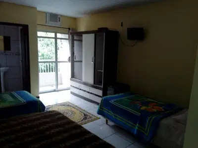Uma cama ou camas num quarto em Maranata Hotel