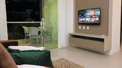 Uma televisão e/ou sistema de entretenimento em 1070 - Praia de Bombinhas locação de temporada.