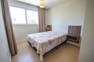 Uma cama ou camas num quarto em 1032 - Apartamento para locação no centro de Bombinhas - Residencial Boulervard - 210