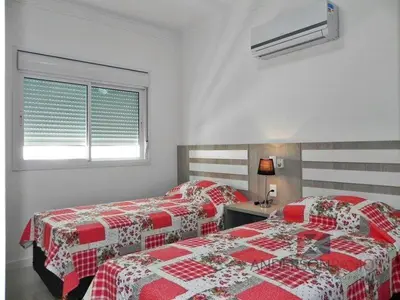 Uma cama ou camas num quarto em 1058 - Praia de Bombinhas locação de temporada