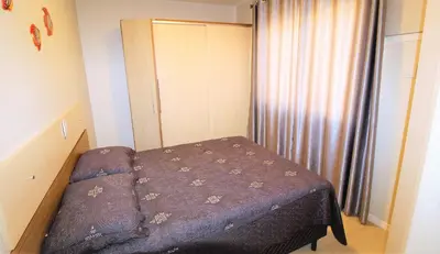 Uma cama ou camas num quarto em 1052 - Apartamento com vista para o mar em Bombinhas - Residencial Salema Apto 301
