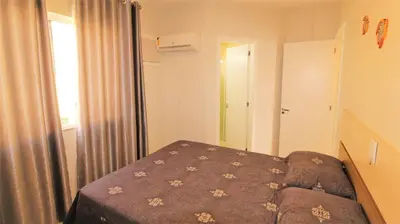 Uma cama ou camas num quarto em 1052 - Apartamento com vista para o mar em Bombinhas - Residencial Salema Apto 301