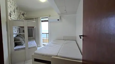 Uma cama ou camas num quarto em Lindo Apto Itapema Meia Praia Frente ao Mar, 6 pessoas, alto padrão