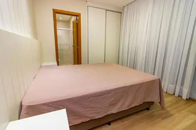 Uma cama ou camas num quarto em 1078 - Apartamento com vista para o mar em Bombinhas