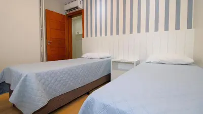 Uma cama ou camas num quarto em 1079 - Apartamento com vista para o mar em Bombinhas