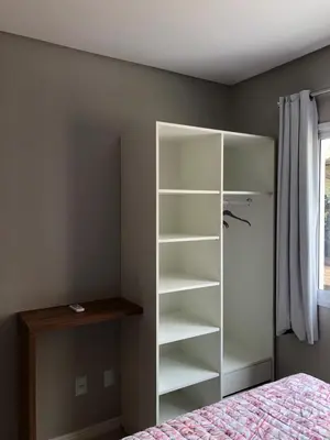 Uma cama ou camas num quarto em Costa Azul - EXCELENTE LOCALIZAÇÃO
