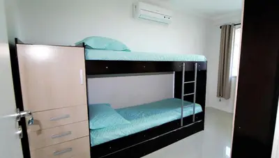 Uma cama ou camas num quarto em 1020 - Apto 03 dormitórios para locação em Bombinhas - Residencial Alameda Verde Apto 201