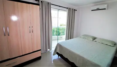 Uma cama ou camas num quarto em 1020 - Apto 03 dormitórios para locação em Bombinhas - Residencial Alameda Verde Apto 201