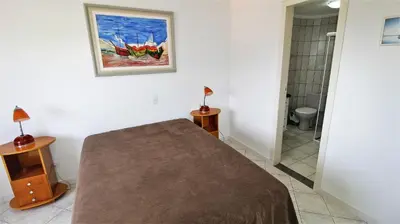 Uma cama ou camas num quarto em 1021 - Cobertura em Bombinhas com Vista para o Mar