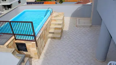 A piscina em ou perto de 1027 - Cobertura para locação em Bombinhas com piscina - Residencial Baia Azul Apto 503 A