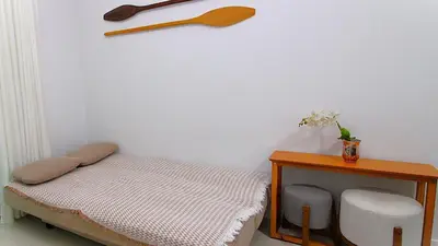 Uma cama ou camas num quarto em 1040 - Apartamento para locação em Bombinhas - Residencial Egídio Pinheiro Apto 206 A