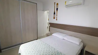 Uma cama ou camas num quarto em 1041 - Apartamento na Praia de Bombinhas para locação - Residencial Egídio Pinheiro 304 B