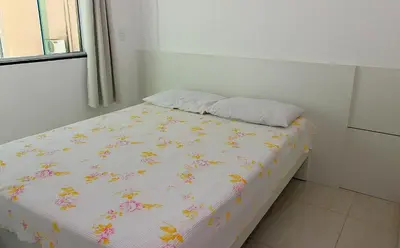 Uma cama ou camas num quarto em 1055 - Apartamento para locação em Bombinhas - Residencial Atalanta Apto 204 B