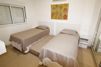 Uma cama ou camas num quarto em 1081 - Praia de Bombinhas locação de temporada