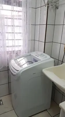 Uma cama ou camas num quarto em Apto pé na areia em Meia Praia Itapema, 3 dormitórios